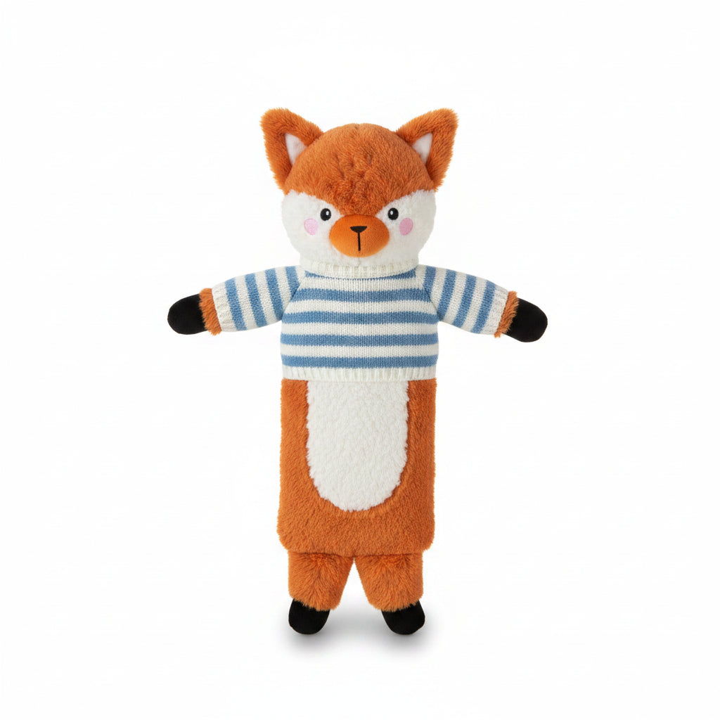Fox Hot Water Bottle with striped jumper lying on sheepskin rug beside a cup of tea.