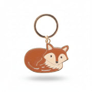 Close-up of Freddie Fox enamel keyring with orange and cream fox design on gold ring.
