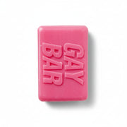 Hot-pink novelty soap bar embossed “GAY BAR” on white background – rose-scented LGBTQ+ gift from Contempo.