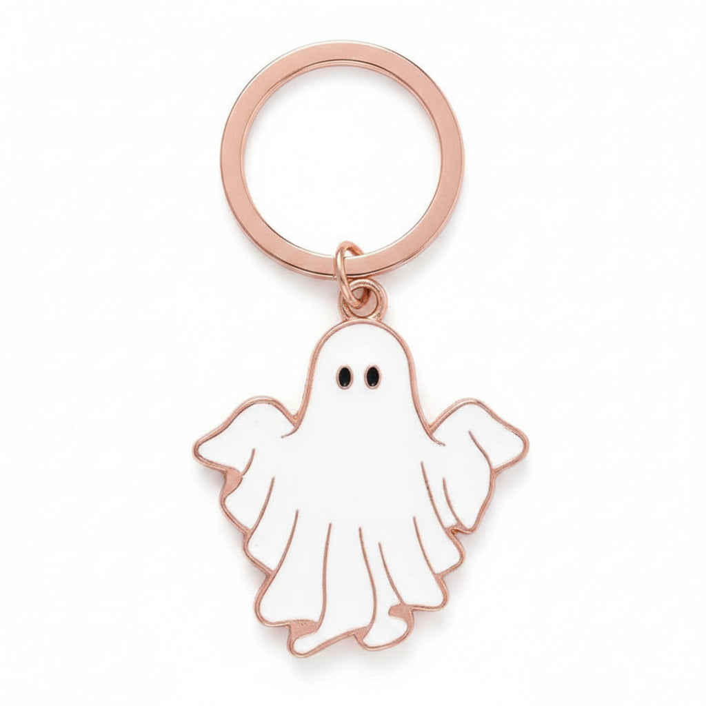 Front of Groovy Ghost keyring featuring white enamel ghost charm with gold edges – fun and playful Halloween keychain