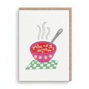 White get well card with a pink bowl of soup spelling feel better