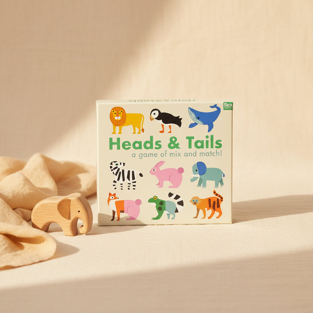 Front of Heads and Tails Game box showing animals like lion, puffin, whale, zebra, rabbit and more.