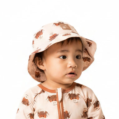Cream highland cow bucket hat flat lay or worn view
