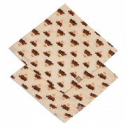 Two highland cow muslin squares flat on split background