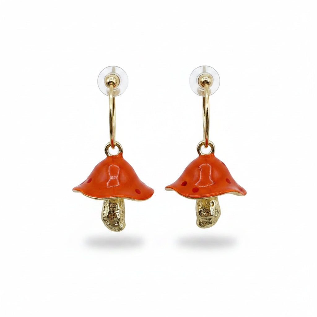 Isolated product shot of Forage Red Earrings, showing one front view and one angled underside view with shimmering golden gills and curved mushroom design.
