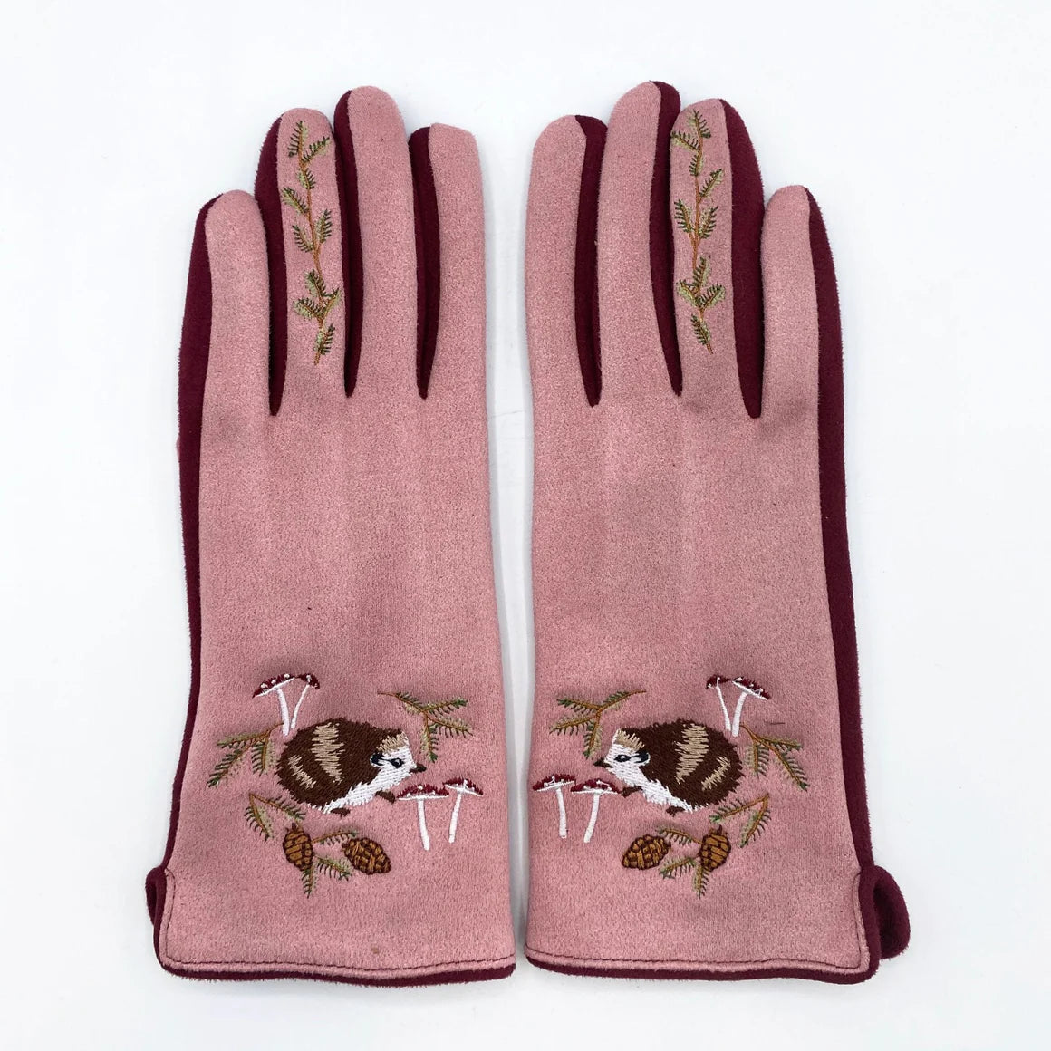 Pair of Secret Garden Hedgehog gloves laid flat, showcasing intricate embroidery and soft detailing.