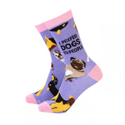 Pair of women’s bamboo socks with “I Prefer Dogs to People” text and colourful dog illustrations on a lilac background with pink toes and cuffs.