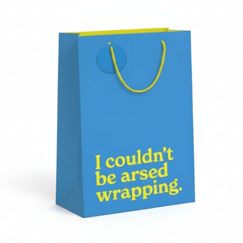Teal blue medium gift bag with gold slogan text on white background.
