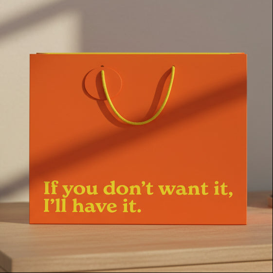 Orange If You Don't Want It I'll Have It gift bag on wooden table