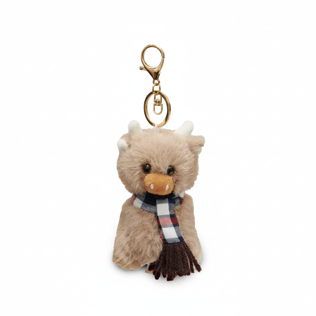 Keyring in the shape of a soft highland cow wearing a tartan scarf.