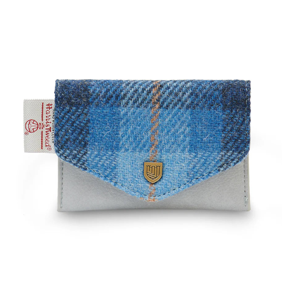 Front view of Islander Blue Tartan Harris Tweed Card Holder featuring a soft blue base, envelope-style flap, metal crest detail, and Harris Tweed certification tag.