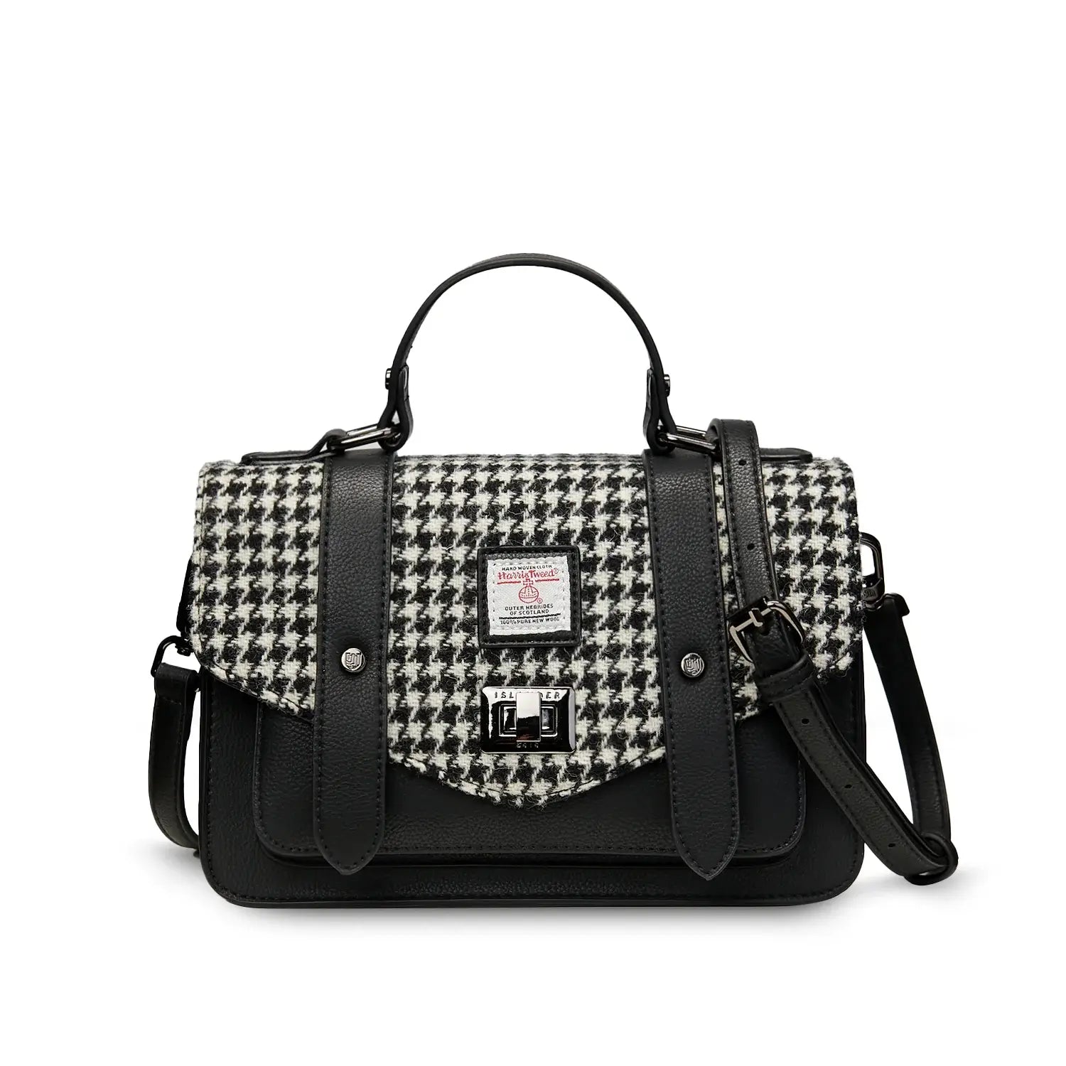 Black and white dogtooth Harris Tweed satchel with black handle on white background