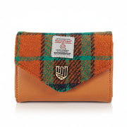 Orange-blue tartan Harris Tweed clasp purse overhead on white background.