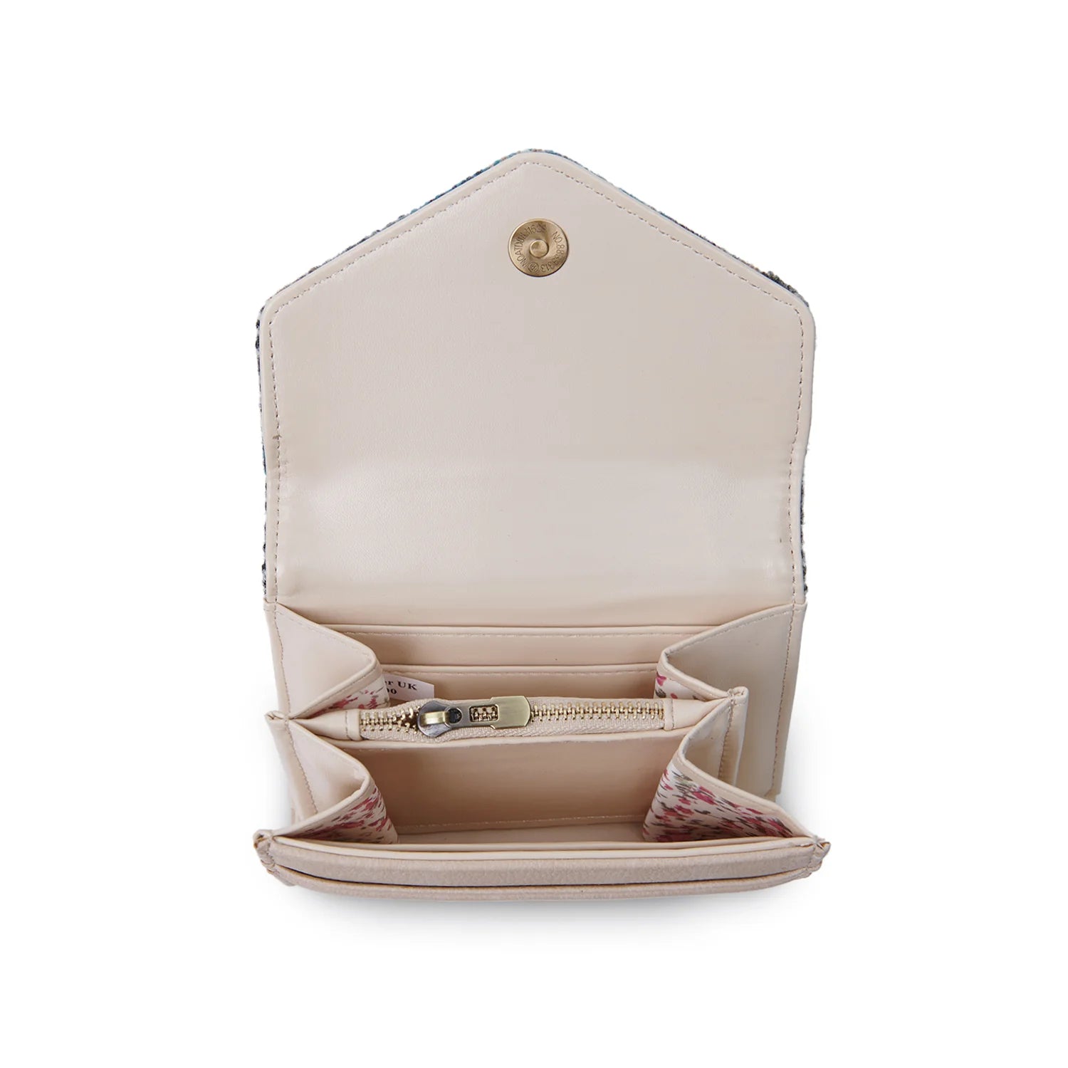 Interior view of the purse showing cream faux leather lining, zipped coin pocket, and card compartments with patterned fabric accents.