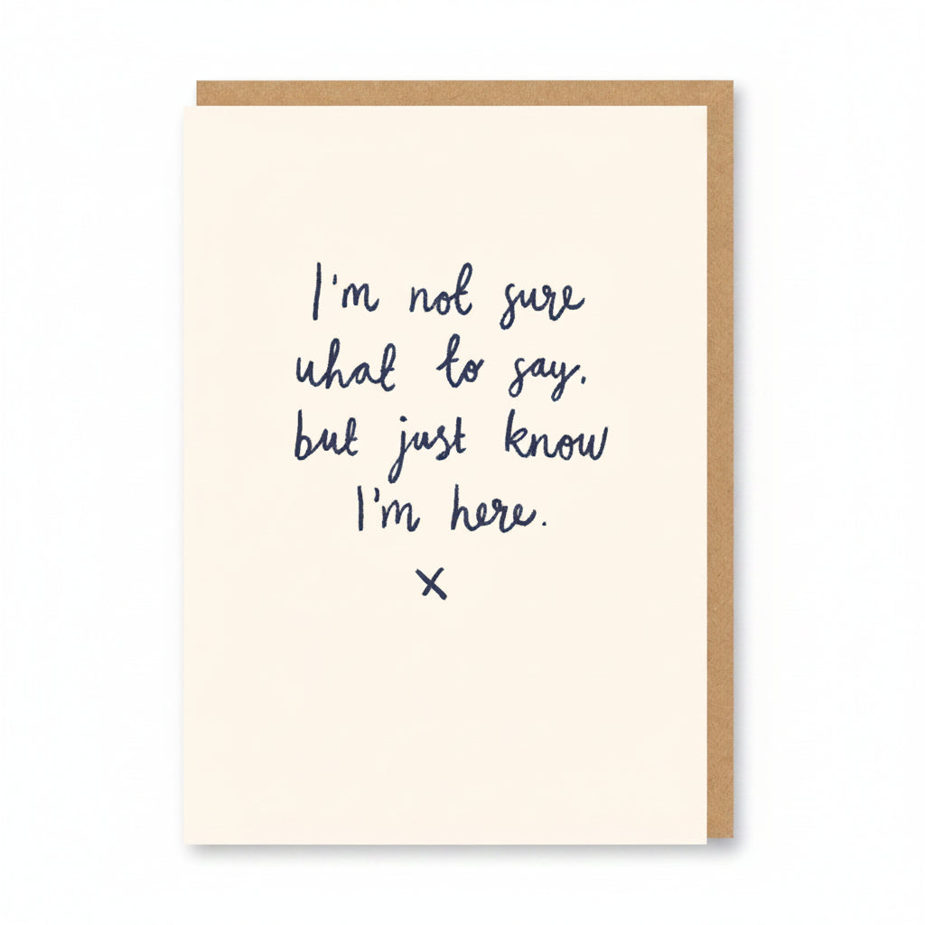 Cream sympathy card with handwritten navy script and a small kiss