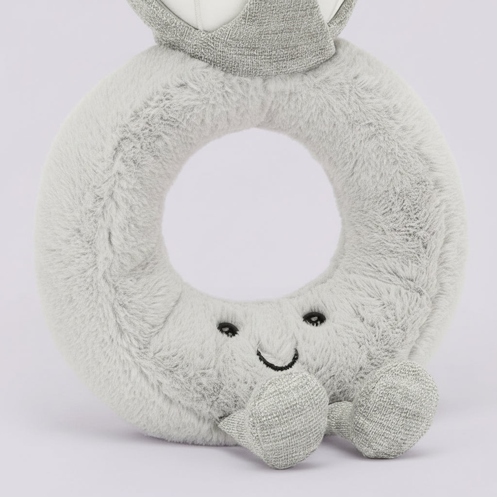 Plush toy shaped like the number 8 with a face on a white background