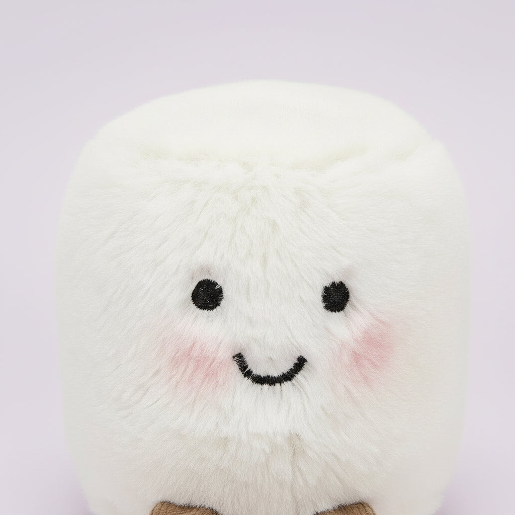 Two plush toys, one pink and one white, with smiling faces on a white background