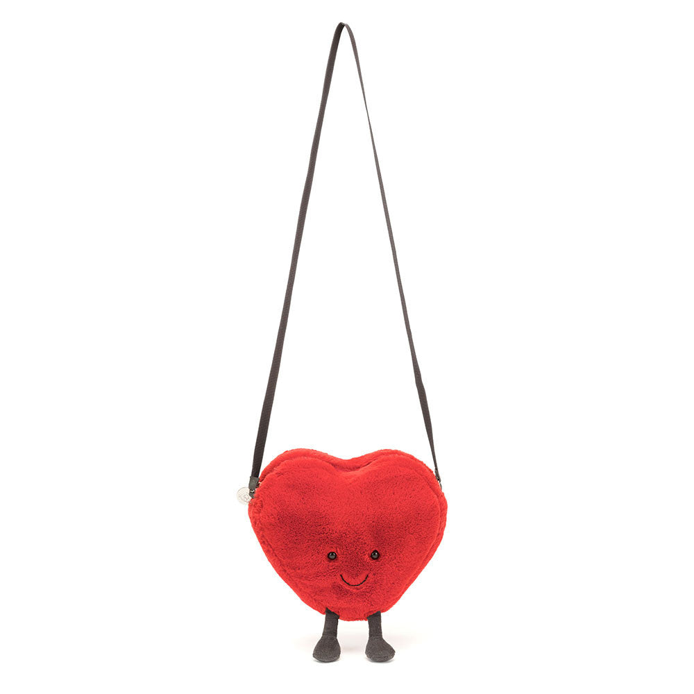 Jellycat Amuseables Heart Bag hanging from its long strap, full front view.
