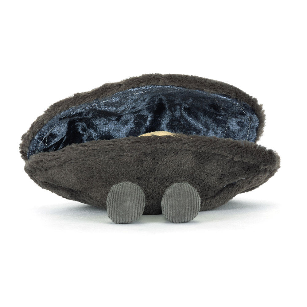 Back view of Michelle Mussel plush showing corduroy legs and shell texture.