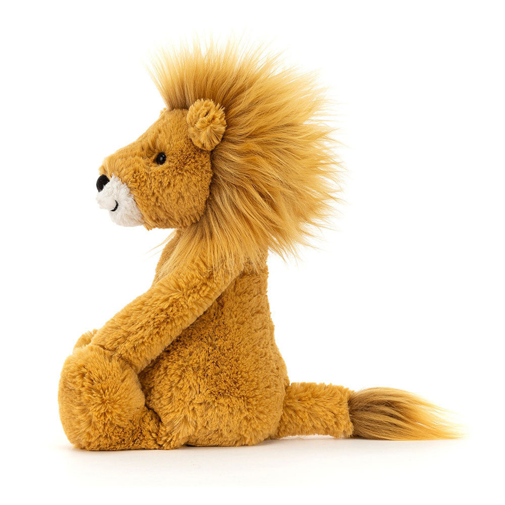 Side profile of Jellycat Bashful Lion showing his long limbs, soft tail, and full plush mane.