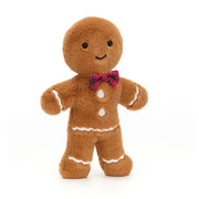 Front view of Jellycat Jolly Gingerbread Fred plush toy with red tartan bow tie and stitched white icing details.