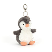 Angled View: Bring a smile to your bag with the Peanut Penguin Bag Charm! (17 cm x 6 cm) This playful penguin features soft fur, waggly fins, and a secure clip. Perfect for penguin lovers on the go!