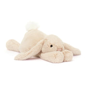 Jellycat Smudge Rabbit with oatmeal coloured fur, long floppy ears and a white fluffy tail.