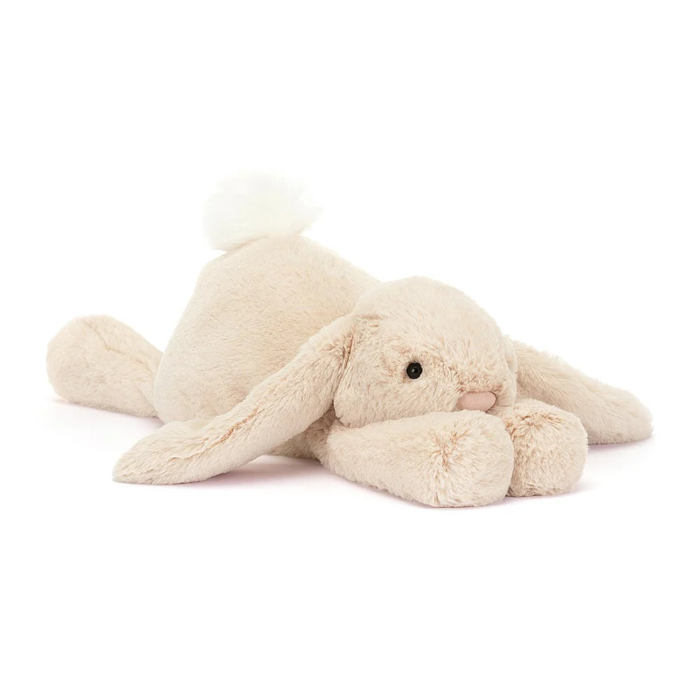 Jellycat Smudge Rabbit with oatmeal coloured fur, long floppy ears and a white fluffy tail.