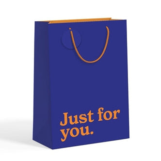 Navy blue medium gift bag with orange slogan text on white background.