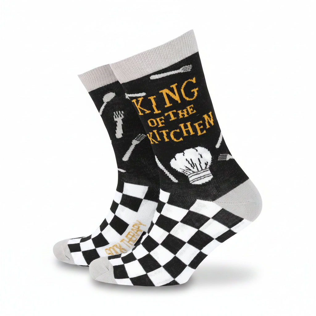 Men’s black bamboo socks with “King of the Kitchen” slogan, chef’s hat, utensils, and black-and-white checkerboard pattern.
