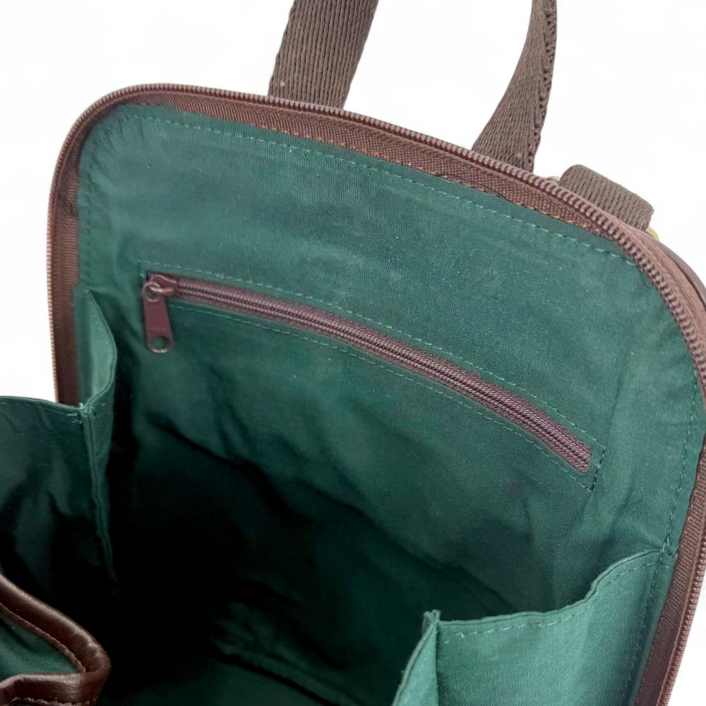 Maccessori embossed branding on brown vegan leather back panel.