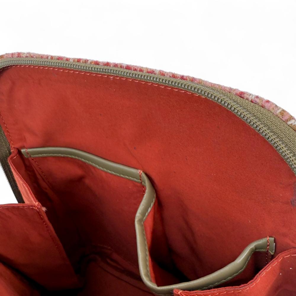 Maple Harris Tweed mini backpack interior showing slip pockets and compartments.