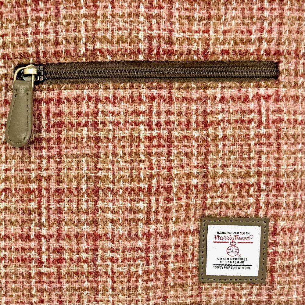Close-up of maple Harris Tweed woven texture and label.