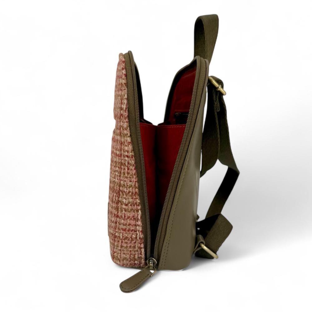 Maple Harris Tweed mini backpack open side view showing zip-to-base design.