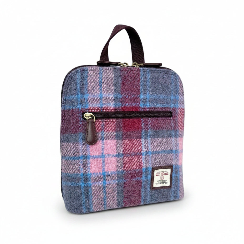 Pastel Pink Harris Tweed mini backpack front angled view on white background.