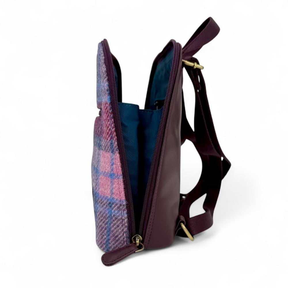 Pastel Pink Harris Tweed mini backpack open side view showing zip-to-base design.