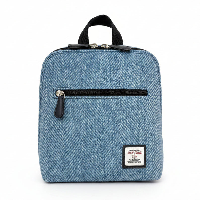 Sky Blue Harris Tweed mini backpack front angled view on white background.