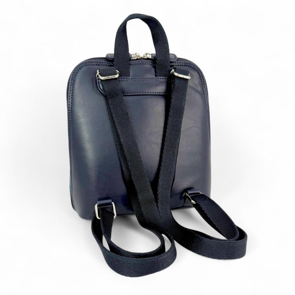 Sky Blue Harris Tweed mini backpack back view showing navy vegan leather and straps.