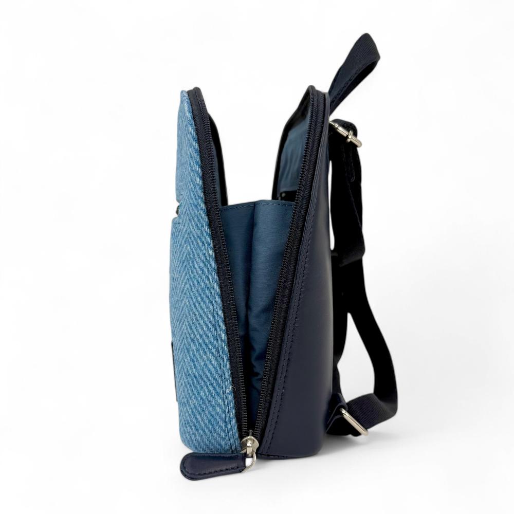 Sky Blue Harris Tweed mini backpack open side view showing zip-to-base design.