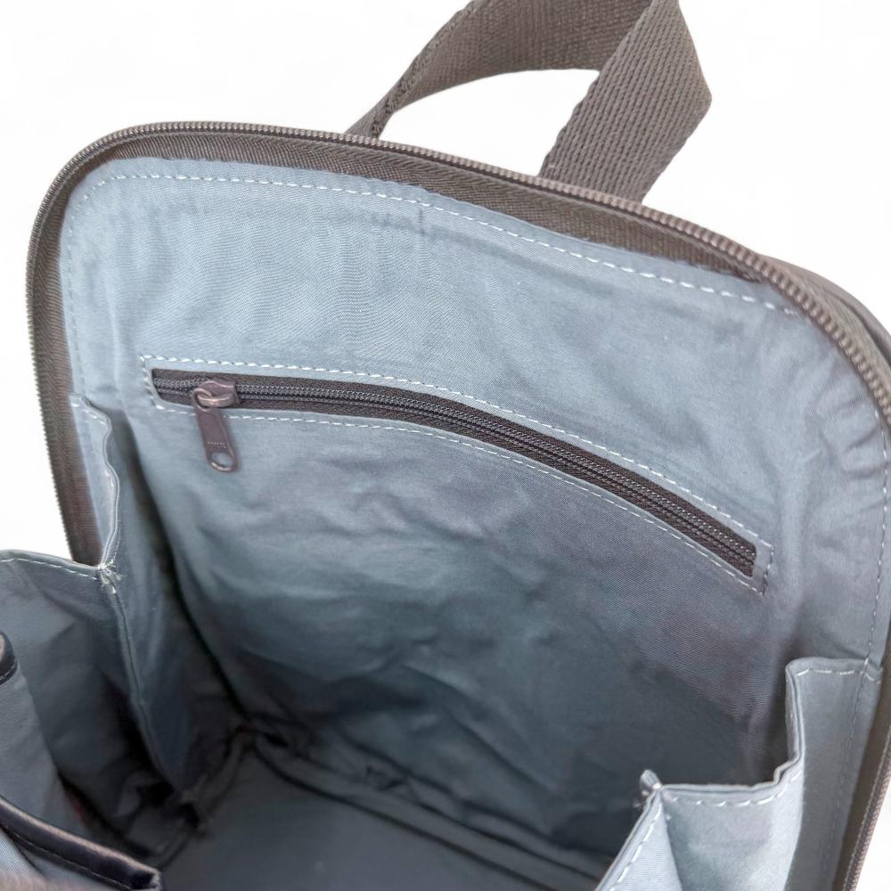 Sky Blue Harris Tweed mini backpack interior showing zip pocket and lining.