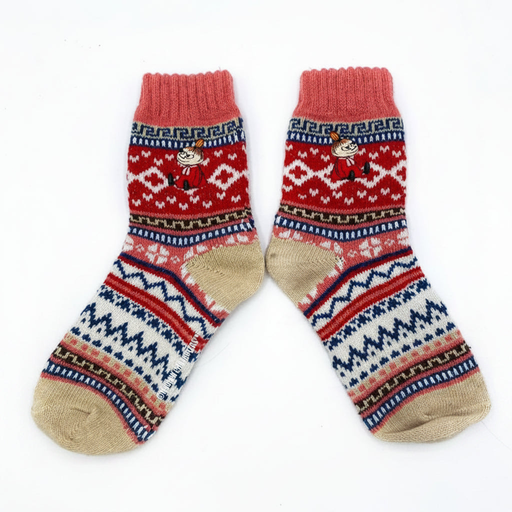 Flat lay of a pair of Fair Isle Moomin socks with Little My embroidery, in red, pink, and biscuit tones with navy and cream accents.