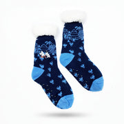 Side view of fluffy Moomin slipper socks with forest knit and embroidered details
