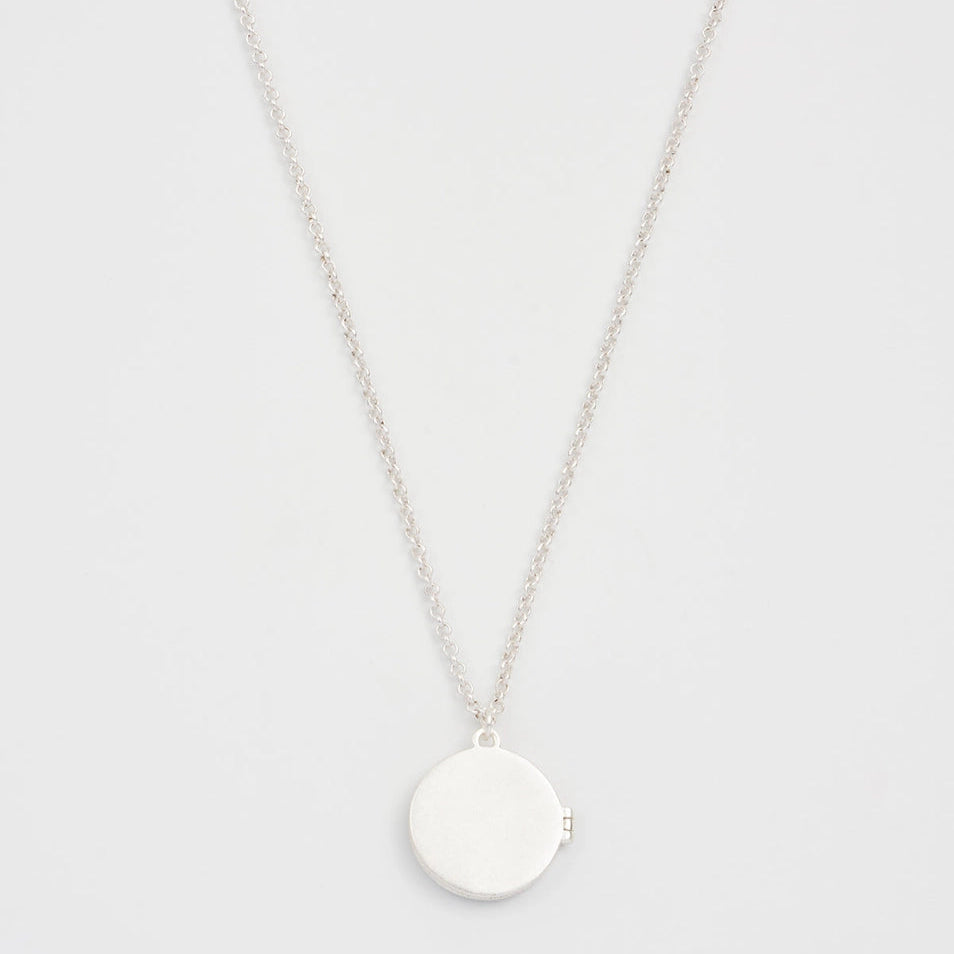 Back view of Nightshade Moon Round Silver Locket on chain.