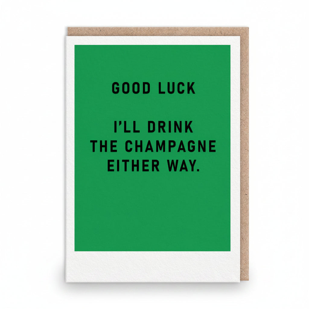 Green good luck card with bold black capitals about drinking the champagne