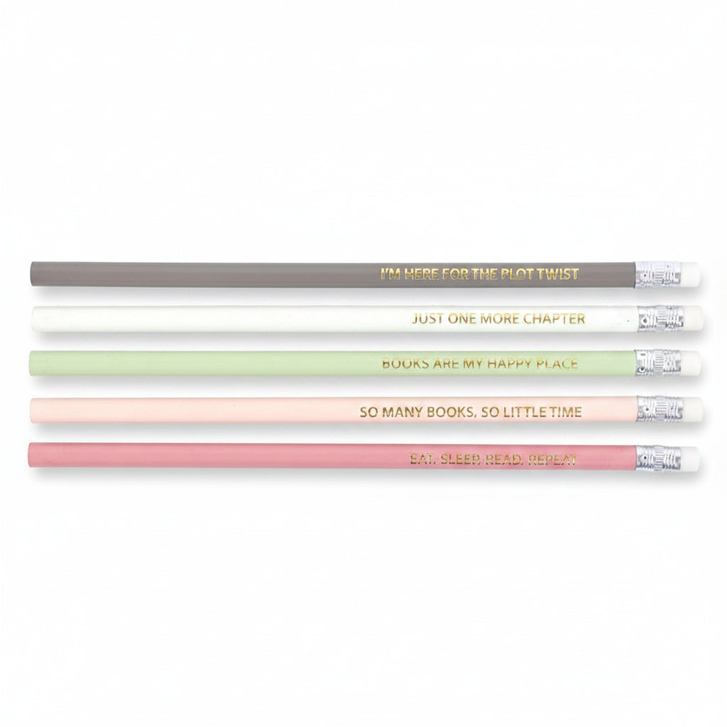 Flat lay of five pastel pencils featuring literary quotes in gold foil.