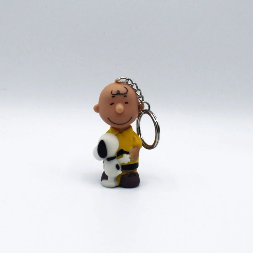 Full front view of Charlie Brown hugging Snoopy keyring against a white background.