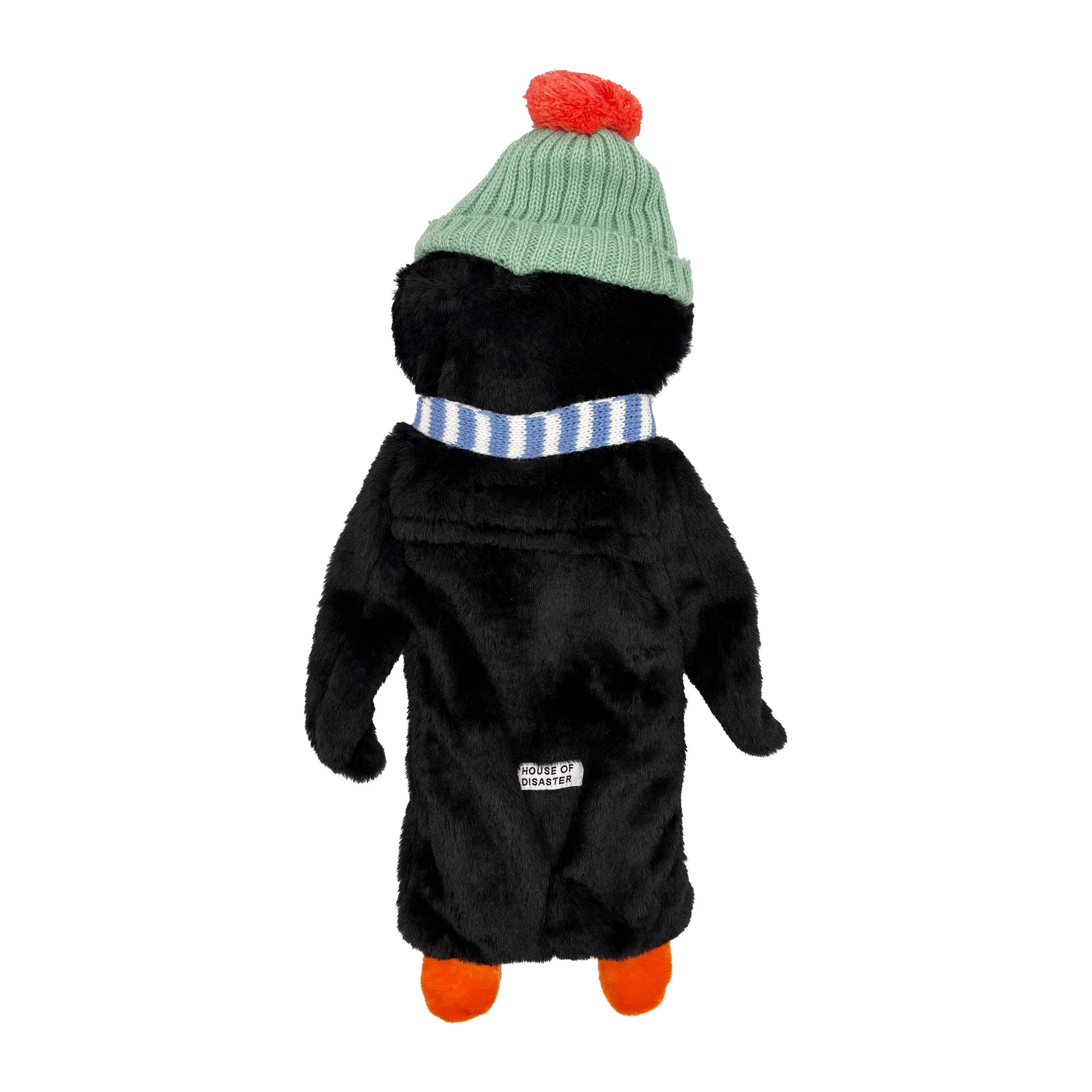 Studio image showing penguin hot water bottle from behind with hat and scarf detail.