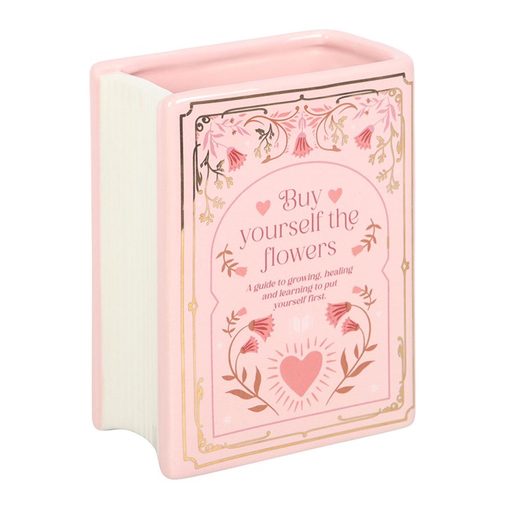 Pink book shaped ceramic vase styled like a vintage hardback with floral accents – decorative vase for fresh or dried flowers.