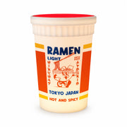 Side profile of the glowing Ramen Light lamp showing its red lid and vibrant orange panel design.