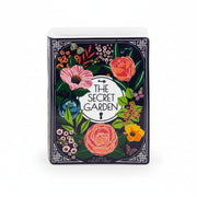 Angled view of Secret Garden ceramic vase shaped like a book with colourful botanical illustrations.